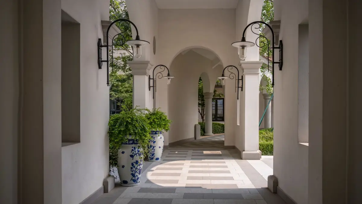 Quiet Mediterranean villa terrace prepared for a family's arrival
